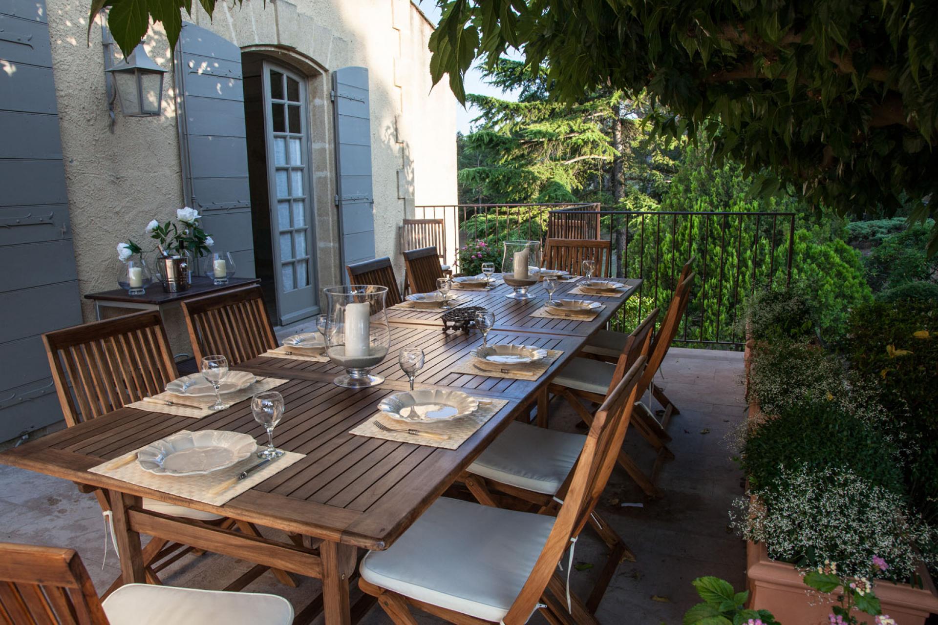 The nice outside dining area in Chateau de la Tour